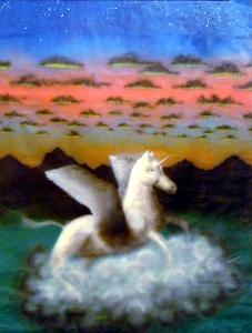 White winged unicorn on a cloud in front of mountainscape